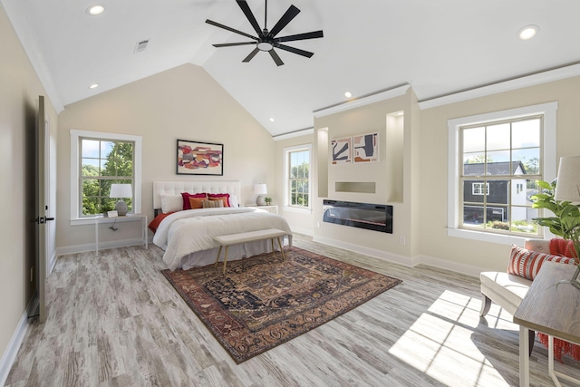 bedroom with ceiling fan, light hardwood / wood-style floors, and crown molding