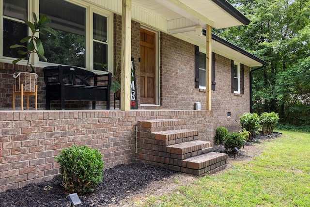 entrance to property featuring a porch