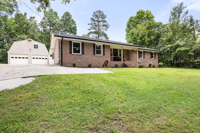 ranch-style house featuring a front lawn, covered porch, an outdoor structure, and a garage