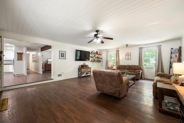 living room featuring dark hardwood / wood-style flooring, ceiling fan, and wooden ceiling