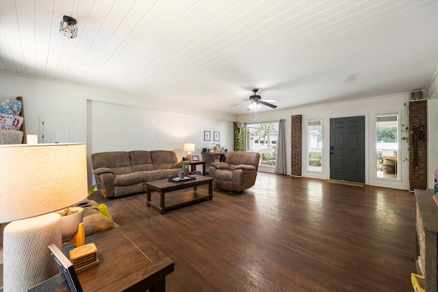 living room with ceiling fan, dark hardwood / wood-style floors, wood ceiling, and a wealth of natural light