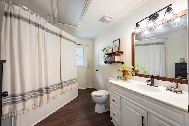 bathroom with crown molding, hardwood / wood-style floors, toilet, vanity, and a shower with shower curtain