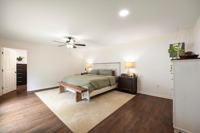 bedroom featuring ceiling fan and dark hardwood / wood-style flooring