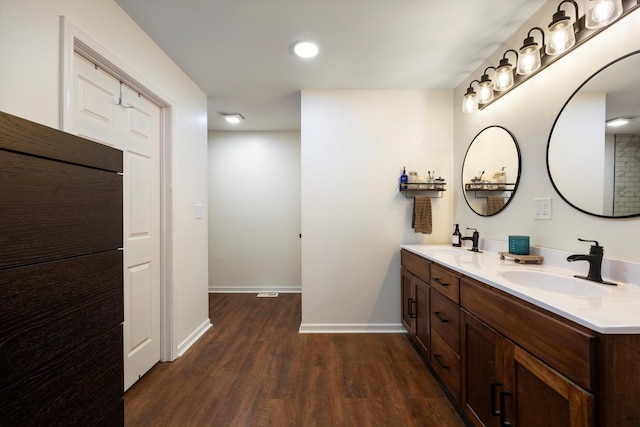 bathroom featuring wood-type flooring and vanity