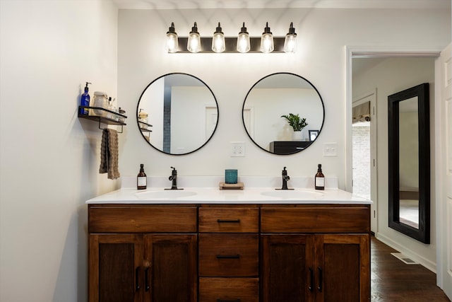 bathroom featuring vanity and wood-type flooring