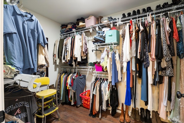 walk in closet featuring dark hardwood / wood-style flooring