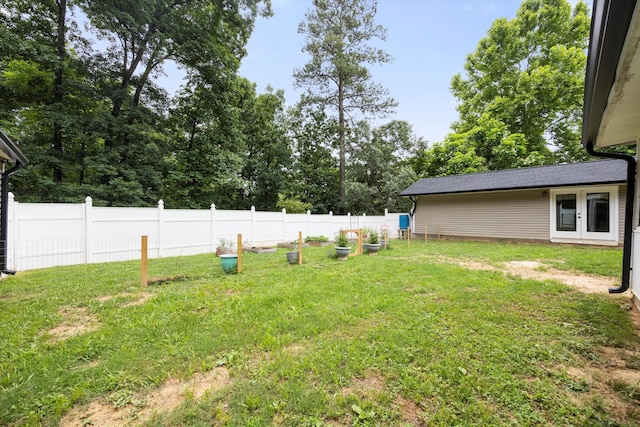 view of yard with french doors