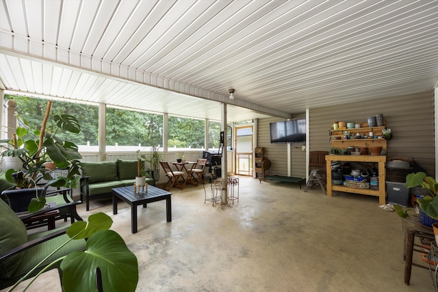 living room with concrete flooring