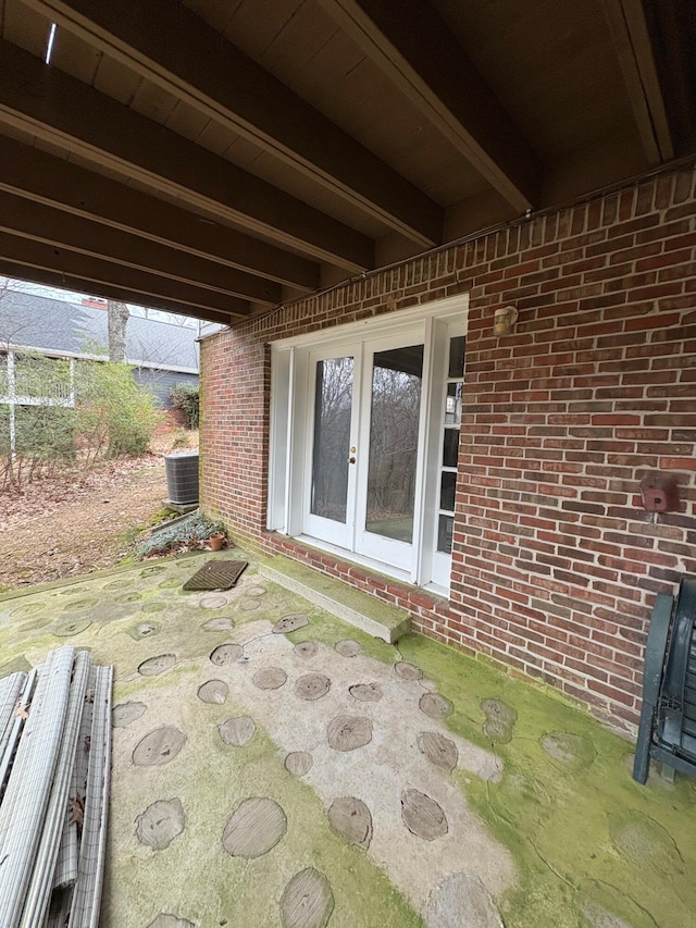 view of patio featuring french doors and cooling unit