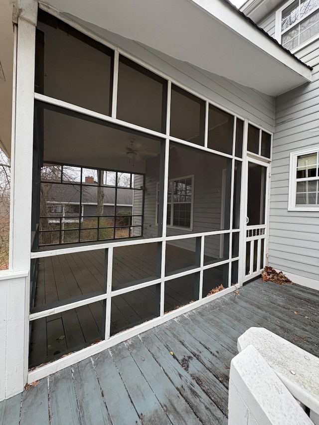 deck with a sunroom