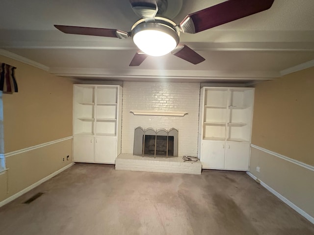 unfurnished living room featuring beamed ceiling, carpet floors, and a fireplace