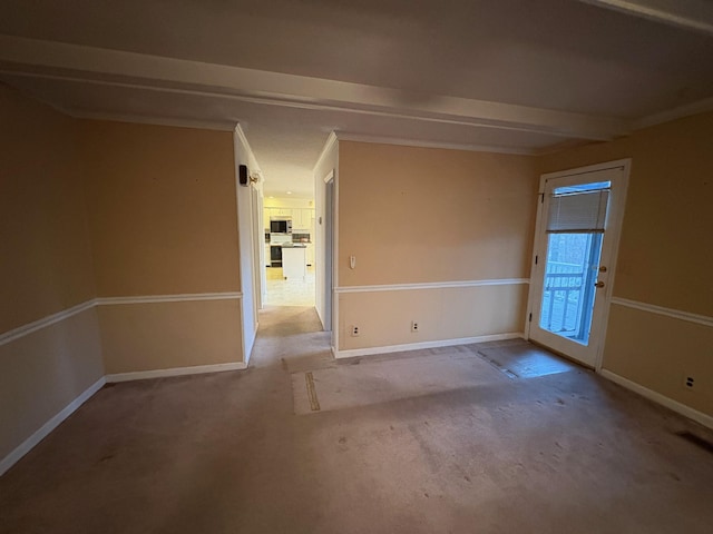 empty room featuring crown molding