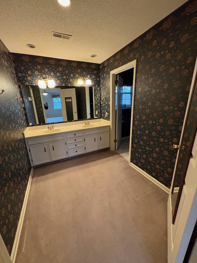 bathroom featuring vanity and a textured ceiling