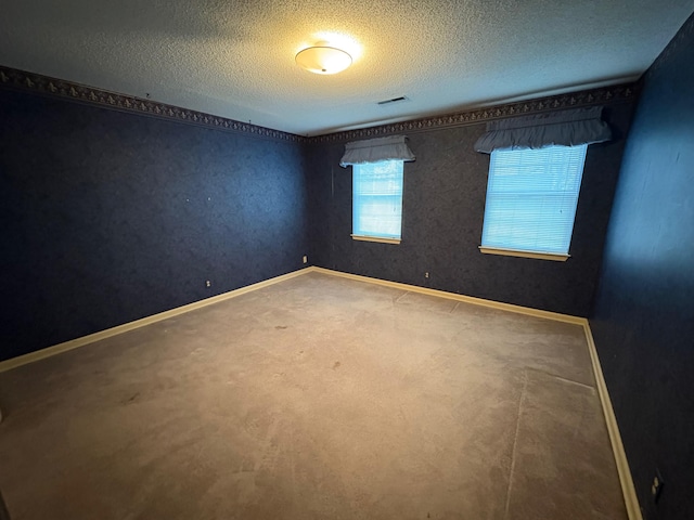 spare room featuring a textured ceiling