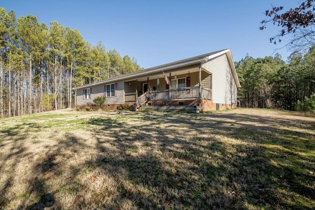 single story home with a porch and a front lawn