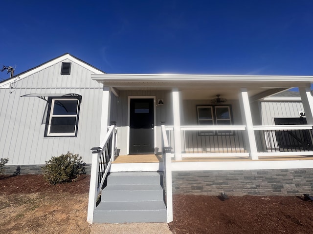 property entrance with covered porch