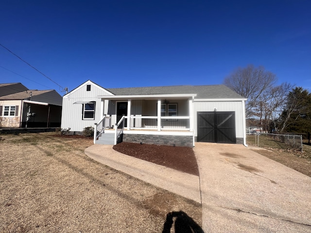 view of front facade with a garage and covered porch