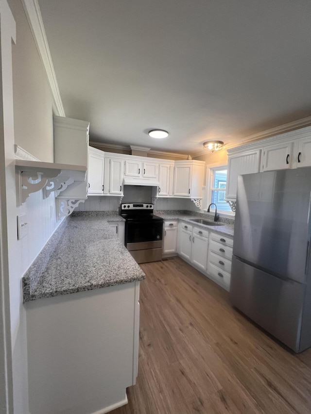 kitchen with sink, crown molding, stainless steel appliances, light stone countertops, and white cabinets