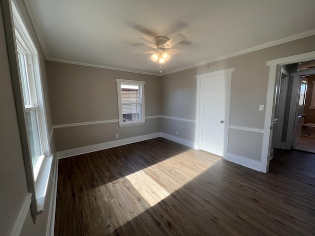 empty room featuring crown molding, ceiling fan, and dark hardwood / wood-style flooring