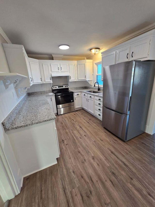 kitchen featuring appliances with stainless steel finishes, wood-type flooring, white cabinets, light stone counters, and crown molding