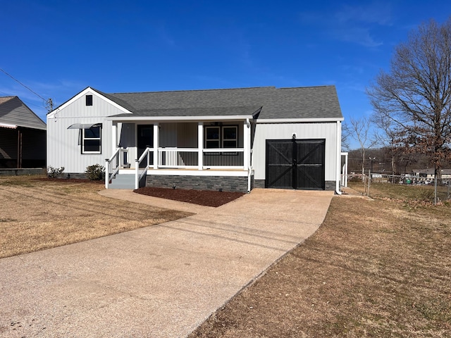 view of front of property with a garage and covered porch