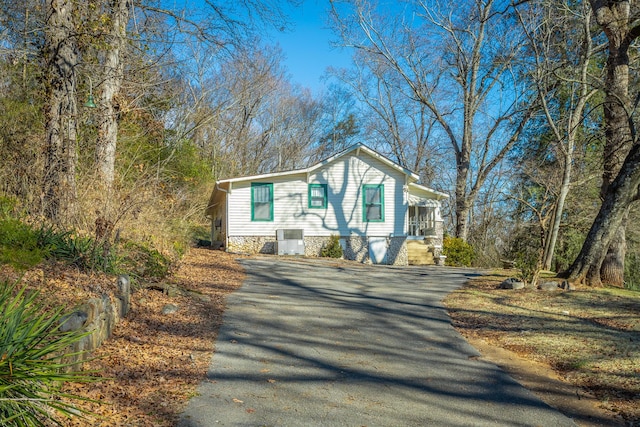 view of front of home featuring cooling unit