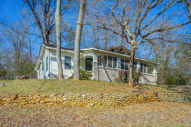 view of front of home with a sunroom