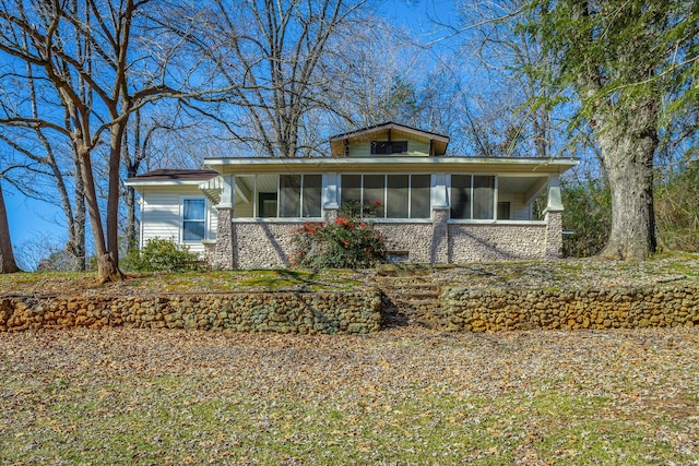 view of front of property featuring a sunroom