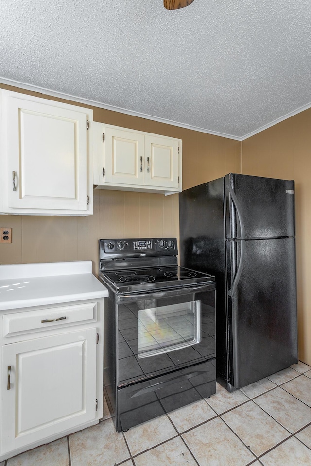 kitchen featuring black appliances, ornamental molding, a textured ceiling, white cabinets, and light tile patterned floors