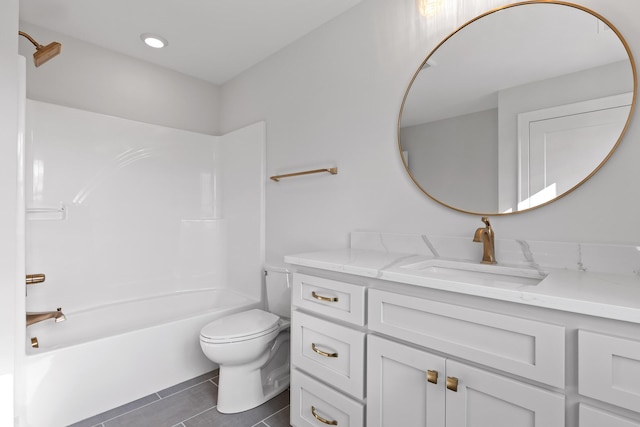 full bathroom featuring tile patterned flooring, vanity, toilet, and washtub / shower combination