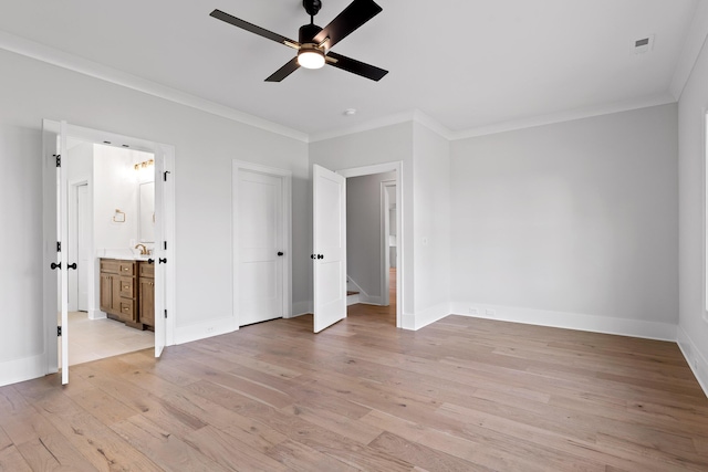 unfurnished bedroom featuring ceiling fan, light hardwood / wood-style floors, ornamental molding, and connected bathroom