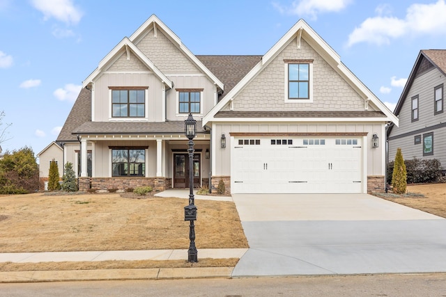 craftsman inspired home featuring french doors, a porch, and a garage