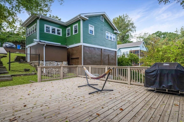 wooden terrace featuring a grill