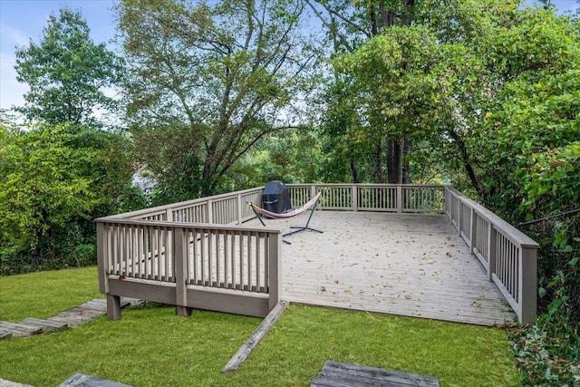 wooden deck with a lawn