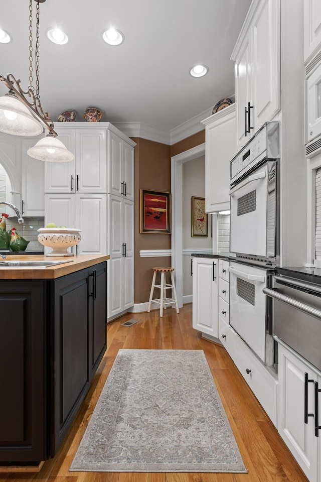 kitchen featuring white cabinets and a center island