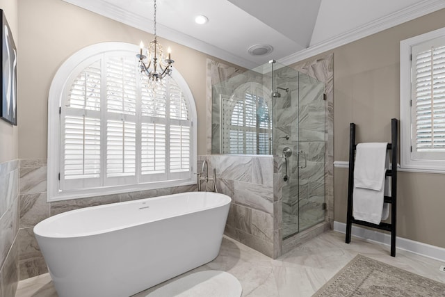 bathroom featuring ornamental molding, tile walls, independent shower and bath, and a notable chandelier