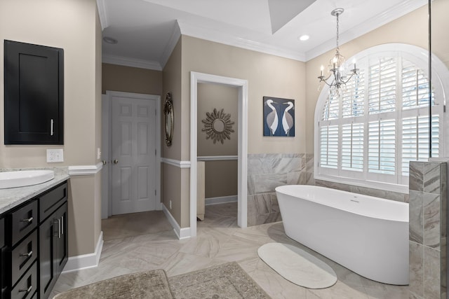 bathroom with ornamental molding, vanity, tile walls, a notable chandelier, and a tub