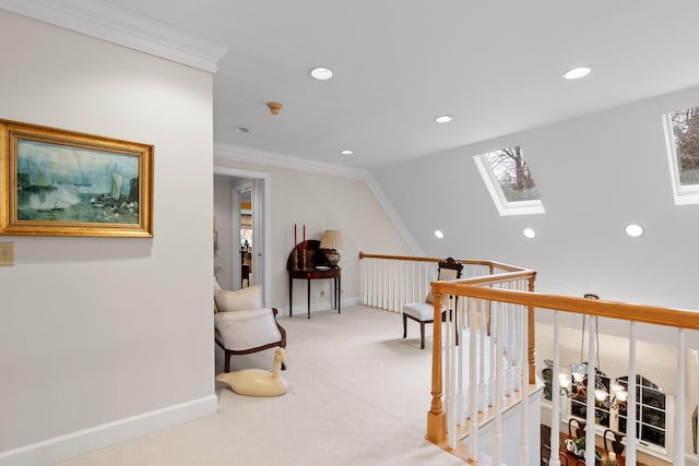 corridor with carpet, ornamental molding, and a skylight