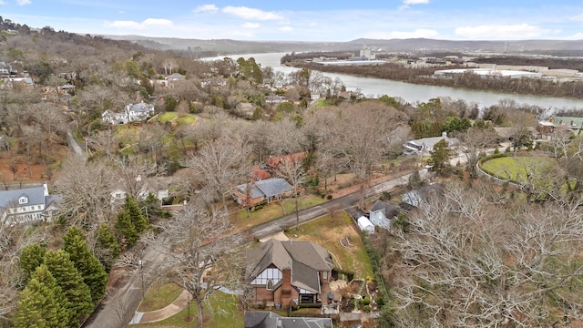 birds eye view of property with a water and mountain view