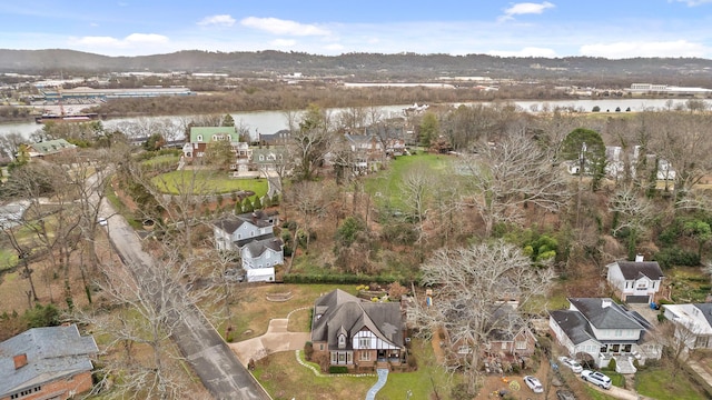 drone / aerial view with a water and mountain view