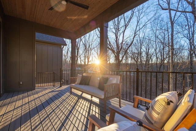 wooden terrace featuring ceiling fan