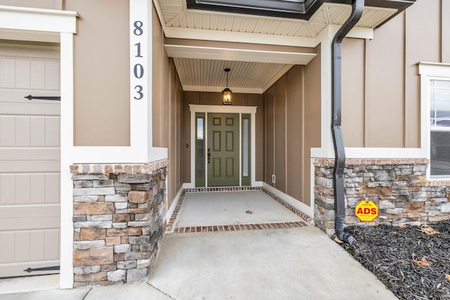 entrance to property featuring a garage