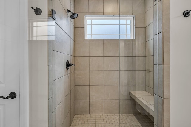 bathroom featuring tiled shower