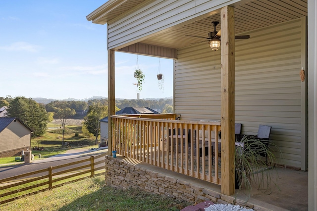 wooden deck with ceiling fan