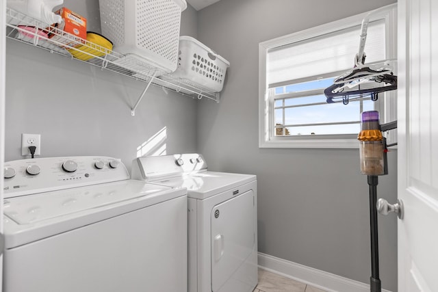 clothes washing area featuring washer and clothes dryer