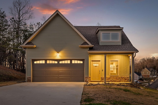 view of front of house featuring covered porch and a garage