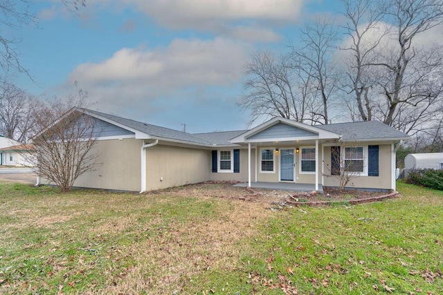 ranch-style house with a front yard and a porch