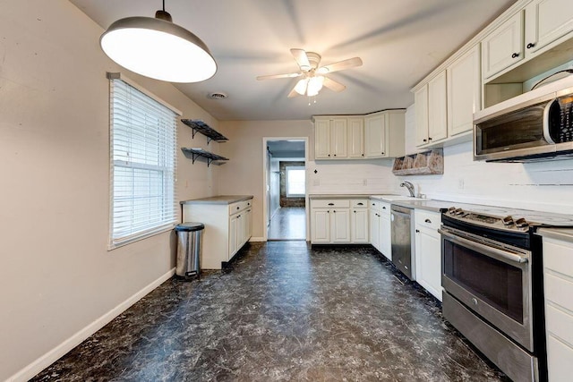 kitchen with ceiling fan, white cabinets, and stainless steel appliances