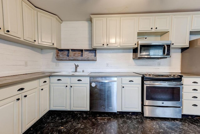 kitchen featuring white cabinets, sink, and stainless steel appliances