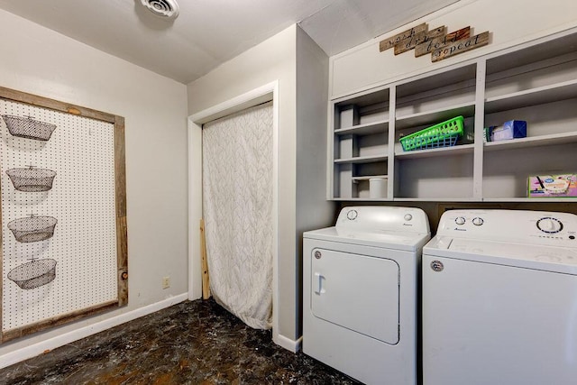 laundry area with washing machine and dryer